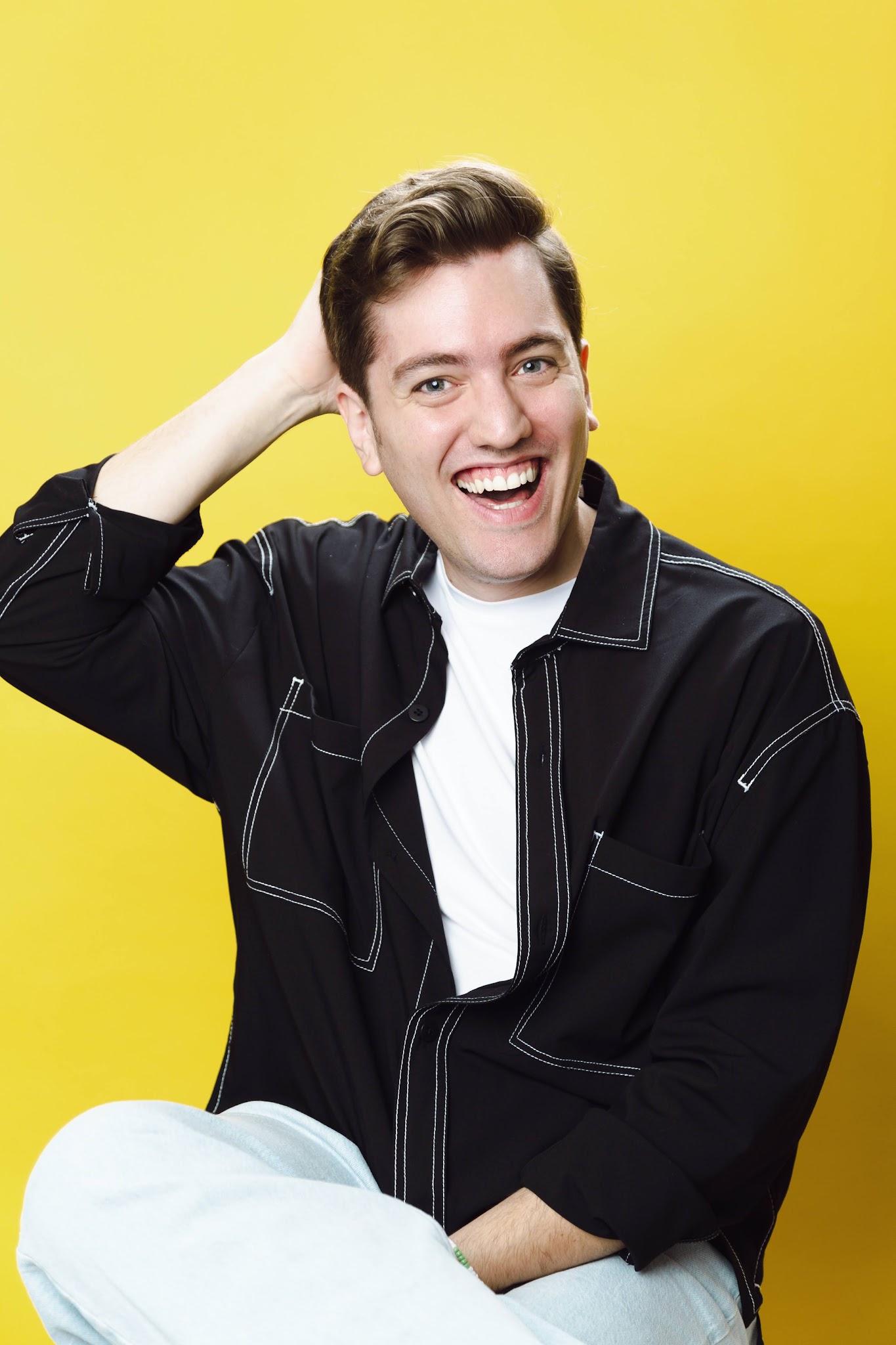 Studio portrait of Jorge Ferreiro, laughing